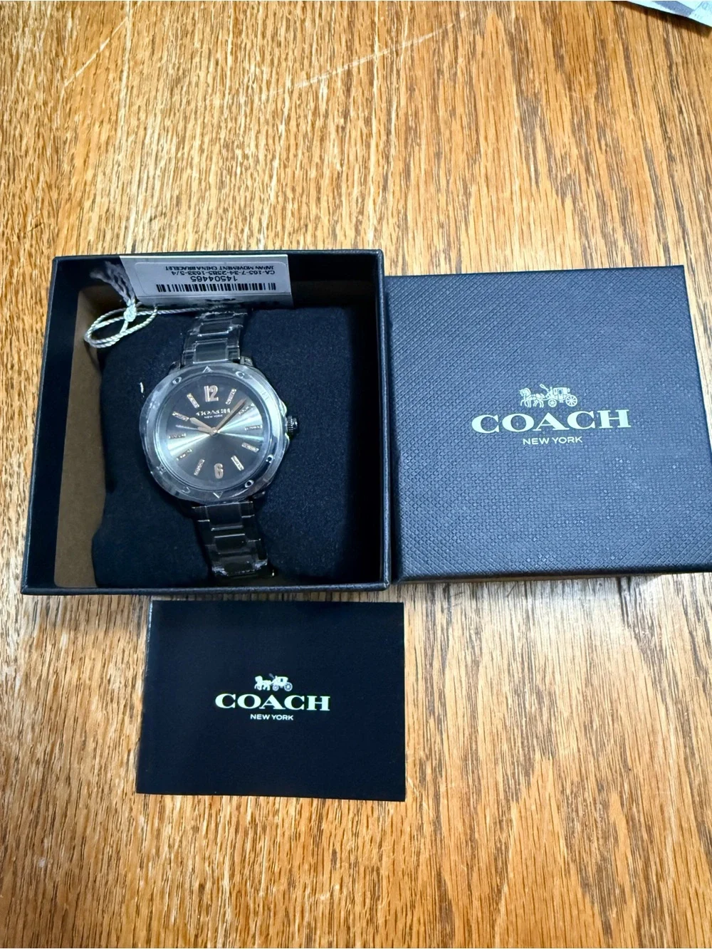 Coach Women’s Silver Bracelet Watch with Gray Dial and Gold Accents